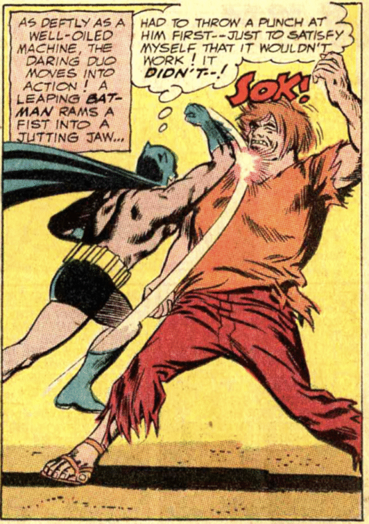 Batman punching a villain.
