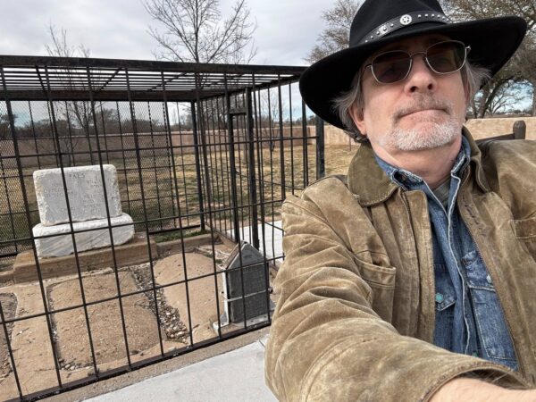 Jeff Mariotte (author) standing in front of the grave site of Billy the Kid